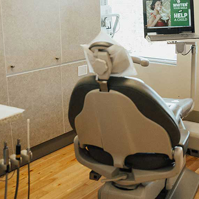 Suction devices next to dental chair